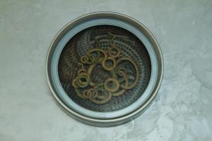 a bowl with a gold design on a wall at Le Sutra Hotel, Khar, Mumbai in Mumbai