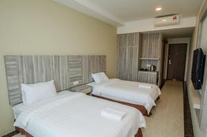 Postel nebo postele na pokoji v ubytování Grand Wonderful Hotel