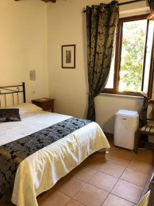 Łóżko lub łóżka w pokoju w obiekcie Villa Tuscany Siena