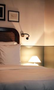 Postel nebo postele na pokoji v ubytování Hotel Sanders