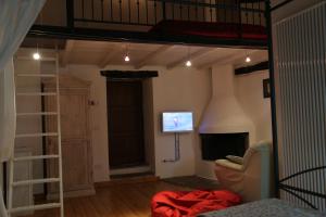 TV a/nebo společenská místnost v ubytování Villa Podere Quartarola