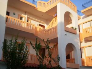 a building with balconies on the side of it at Pentari in Stalos