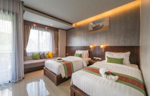 Postel nebo postele na pokoji v ubytování Andaman Breeze Resort