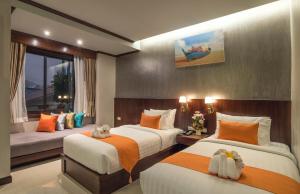 Postel nebo postele na pokoji v ubytování Andaman Breeze Resort