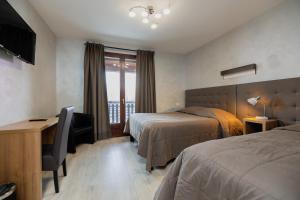 Postel nebo postele na pokoji v ubytování Motel D'ornex