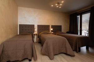 Postel nebo postele na pokoji v ubytování Motel D'ornex
