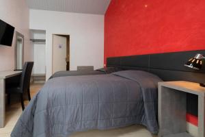 Postel nebo postele na pokoji v ubytování Motel D'ornex