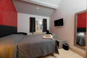 Postel nebo postele na pokoji v ubytování Motel D'ornex