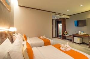 Postel nebo postele na pokoji v ubytování Andaman Breeze Resort