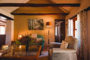 a living room with a couch and a table at Strawberry Hill Farm in Heidelberg