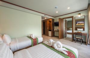Postel nebo postele na pokoji v ubytování Andaman Breeze Resort