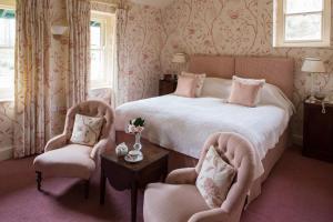 A bed or beds in a room at Gliffaes Country House Hotel