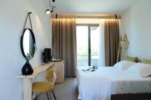 Postel nebo postele na pokoji v ubytování Filippos Hotel