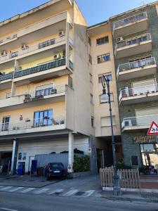 an apartment building with a car parked in front of it at Casa Emilia in Sorrento
