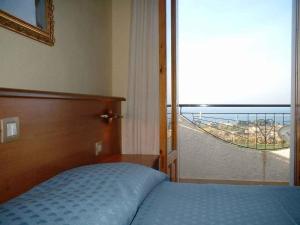 Postel nebo postele na pokoji v ubytování Hotel Il Vulcano
