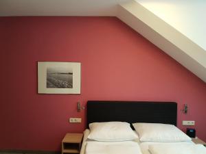 Postel nebo postele na pokoji v ubytování Hotel Aigner