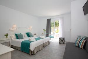Postel nebo postele na pokoji v ubytování Hotel Marina