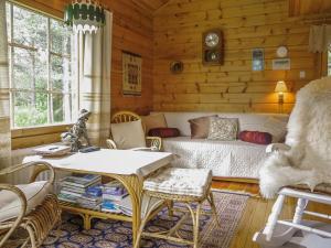 a bedroom with a bed and a table and chairs at Holiday Home Anula by Interhome in Sodankylä