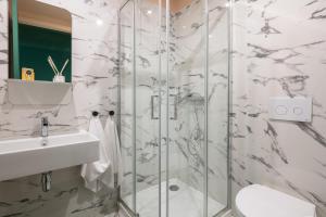 a bathroom with a shower and a sink at Slowly Garden House in Porto +33 photos