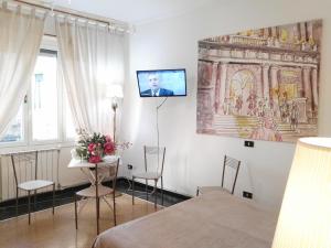 Et tv og/eller underholdning på Fornaro Apartments