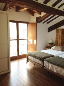 Säng eller sängar i ett rum på Apartamentos Turísticos Rincones del Vino