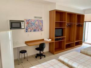 Televisyen dan/atau pusat hiburan di Hotel Flat Alameda