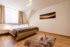 Posteľ alebo postele v izbe v ubytovaní Apartments Menuet