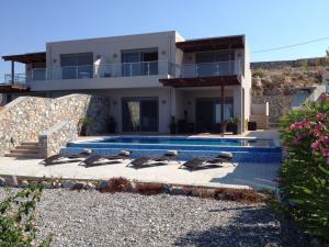 a group of birds sitting in front of a house at Villa Anna in Pefki Rhodes