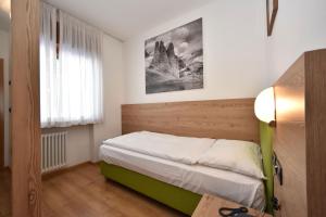 Postel nebo postele na pokoji v ubytování Villa Gemmy