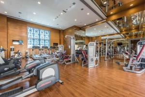 a gym with treadmills and elliptical machines at bnbmehomes - Elegant & Stylish Studio in Downtown - 502 in Dubai