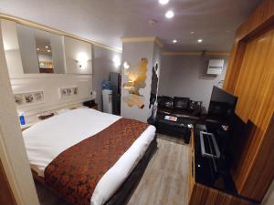 Voodi või voodid majutusasutuse Hotel Allure (Adult Only) toas