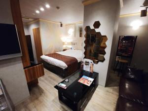 Voodi või voodid majutusasutuse Hotel Allure (Adult Only) toas