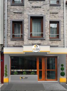 a store front of a building with a sign on it at Set Özer Hotel in Çanakkale