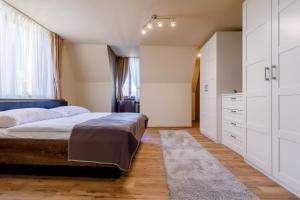 Posteľ alebo postele v izbe v ubytovaní Apartments Menuet