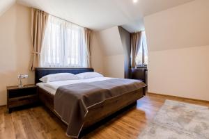 Posteľ alebo postele v izbe v ubytovaní Apartments Menuet