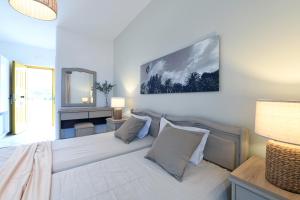 Ein Bett oder Betten in einem Zimmer der Unterkunft Asteras Paradise