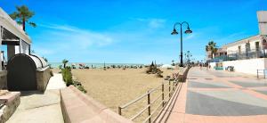 a view of a beach with people on it at Zenbeach 1A playa carihuela in Torremolinos