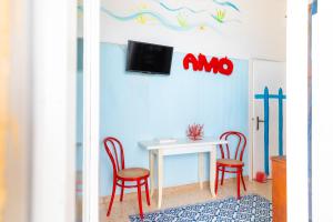 TV a/nebo společenská místnost v ubytování Casa Corallo