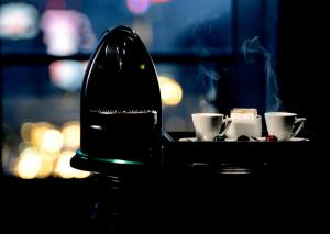 a tray with coffee cups on a table at Grand Hotel Bucharest in Bucharest
