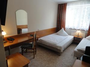 Łóżko lub łóżka w pokoju w obiekcie Hotel Górecki