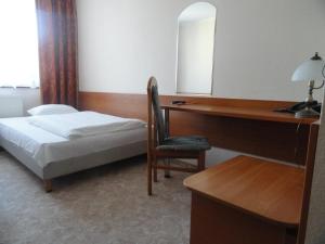 Łóżko lub łóżka w pokoju w obiekcie Hotel Górecki