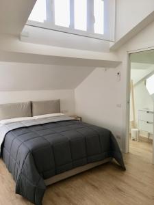 A bed or beds in a room at CORSO VENEZIA APARTMENT