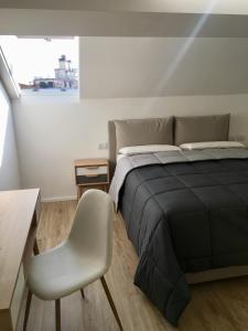 A bed or beds in a room at CORSO VENEZIA APARTMENT Még 17 kép