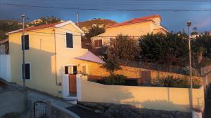 a couple of white houses on a hill at Casa Amarela in Funchal