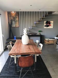 a dining room table with a pineapple on top of it at 3 Impasse Louis Bassède in Argelès-sur-Mer