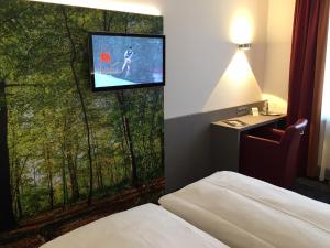 Postel nebo postele na pokoji v ubytování Hotel am Dom