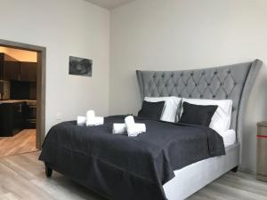 Postel nebo postele na pokoji v ubytování Old Town Boutique Apartments
