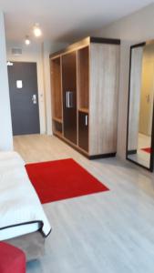 Posteľ alebo postele v izbe v ubytovaní Apartament WELLEN
