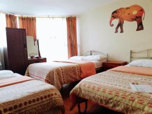 Letto o letti in una camera di Hostal Capri