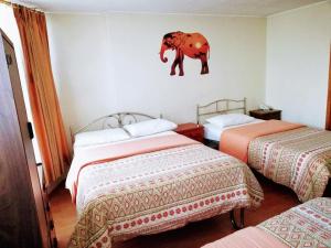 Letto o letti in una camera di Hostal Capri